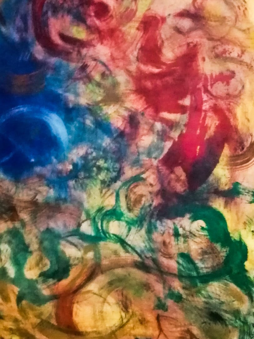 Abstract painting where vibrant colors blend and breathe together on canvas